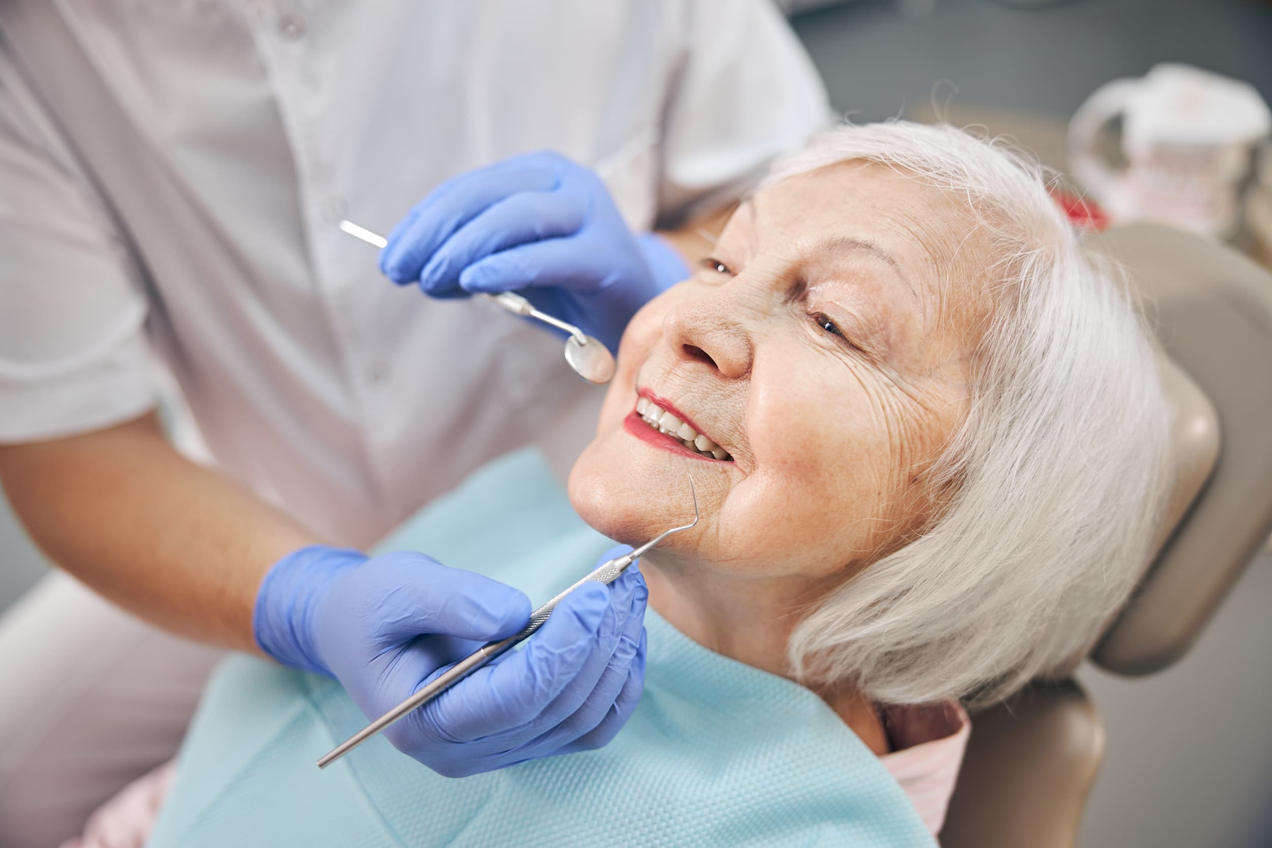 Elderly woman in dentist